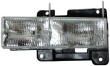 GMC Yukon headlight lens cover and housing assembly